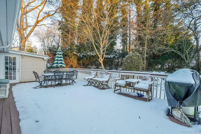 a view of patio with couple of chairs