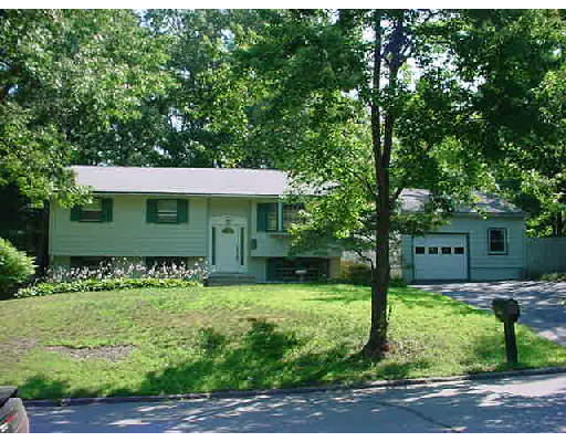 26 Russet Road Billerica, MA 01821 - Photo 1 of 1 a front view of a house with garden