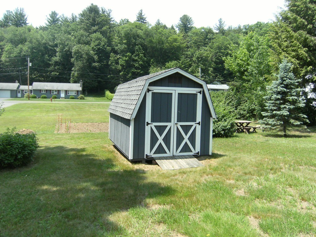 225 Huntington Road Russell, MA 01071 - Photo 20 of 20 a front view of a house with garden