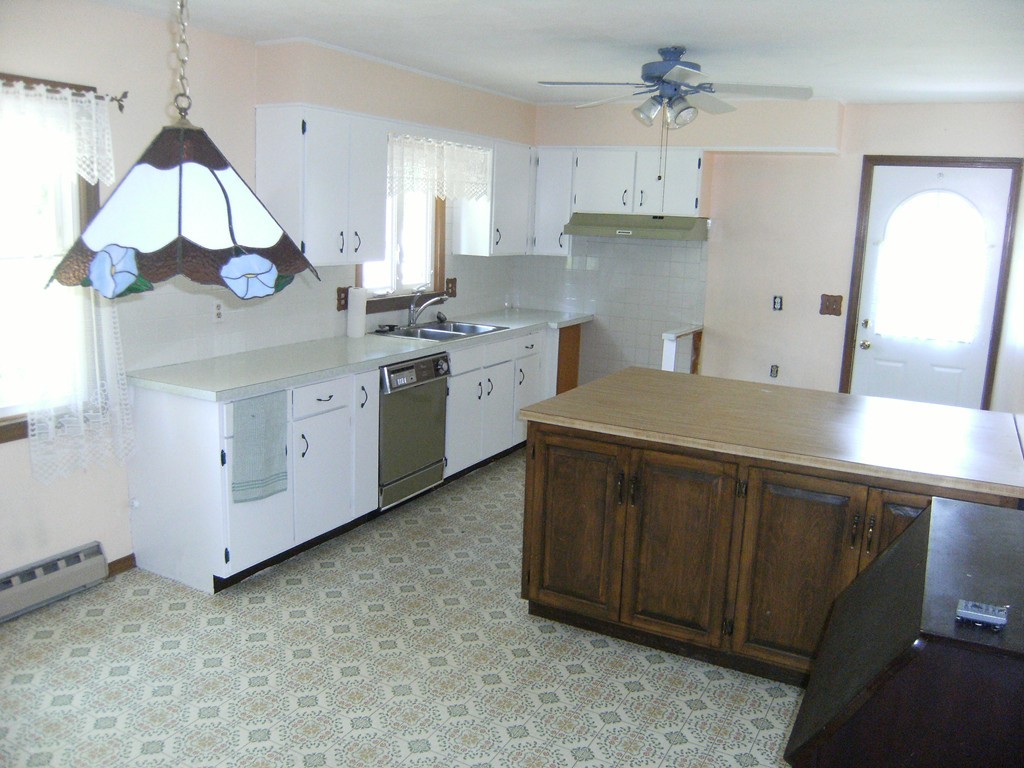225 Huntington Road Russell, MA 01071 - Photo 3 of 20 a kitchen with cabinets a sink and appliances