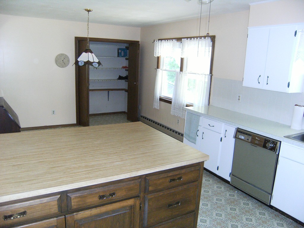 225 Huntington Road Russell, MA 01071 - Photo 4 of 20 a kitchen with a cabinets and window