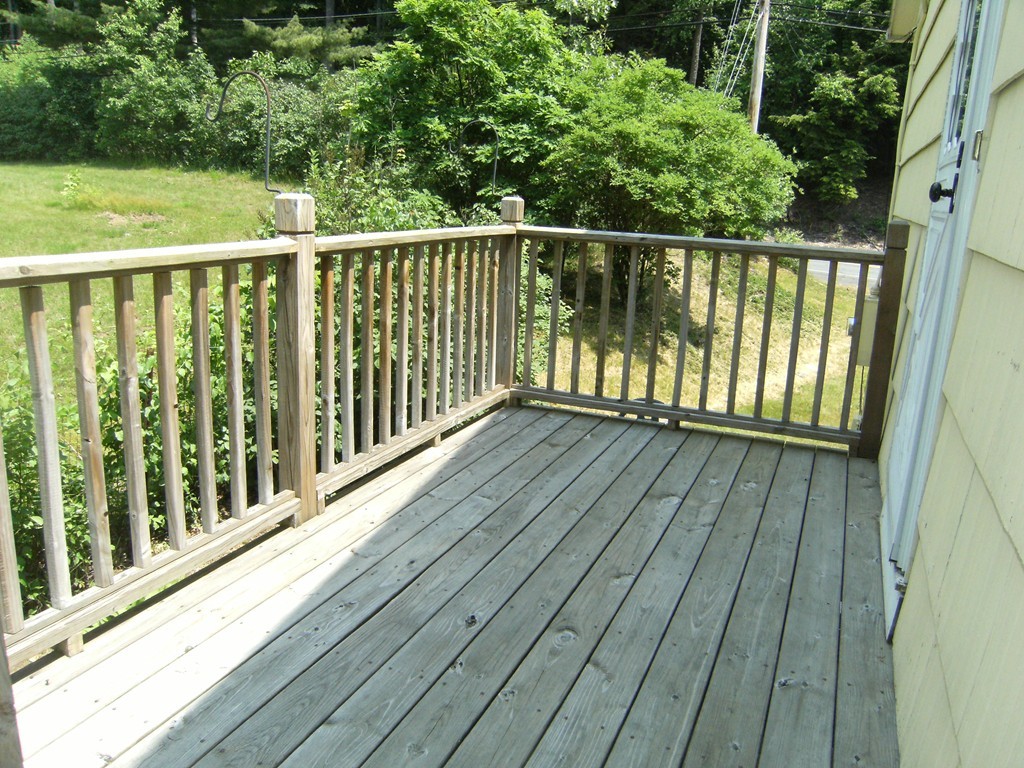 225 Huntington Road Russell, MA 01071 - Photo 5 of 20 a balcony with wooden floor