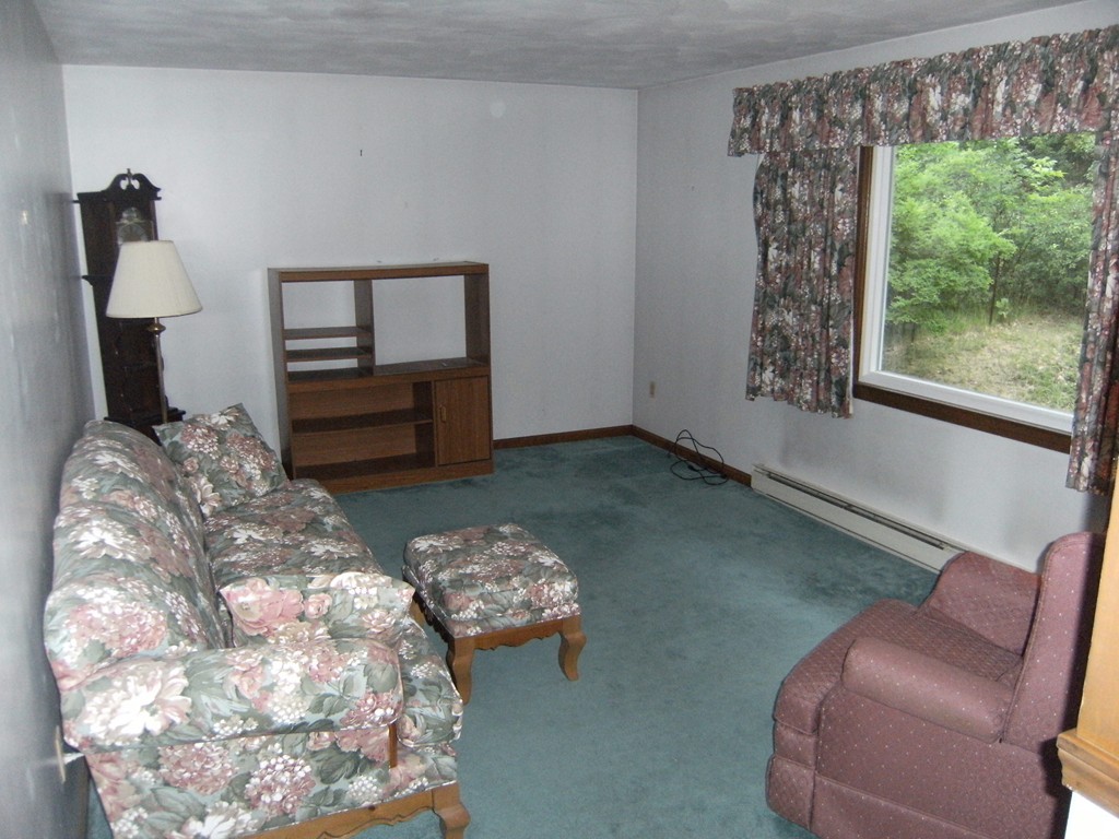 225 Huntington Road Russell, MA 01071 - Photo 6 of 20 a bedroom with furniture and a window