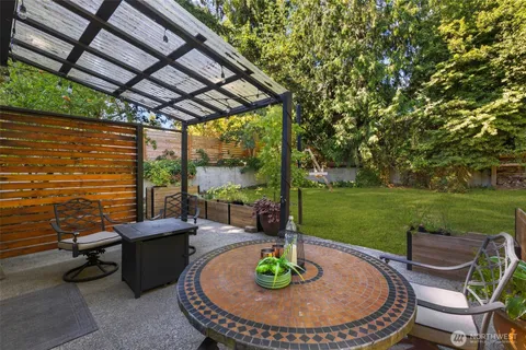 a patio with table and chairs