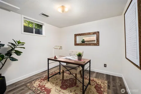 a workspace with furniture and window