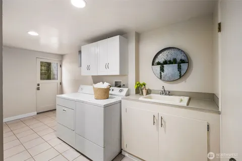 a room with a sink and a mirror