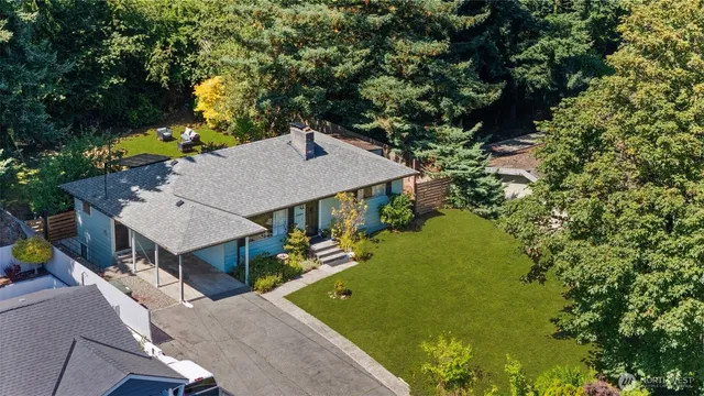 an aerial view of a house with swimming pool garden and patio