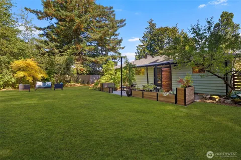 a view of a house with a yard porch and sitting area