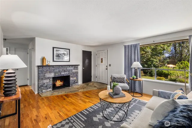 a living room with furniture and a fireplace