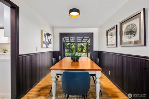 a view of a dining room with furniture window and wooden floor