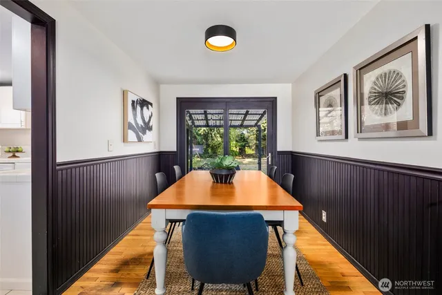 a view of a dining room with furniture window and wooden floor