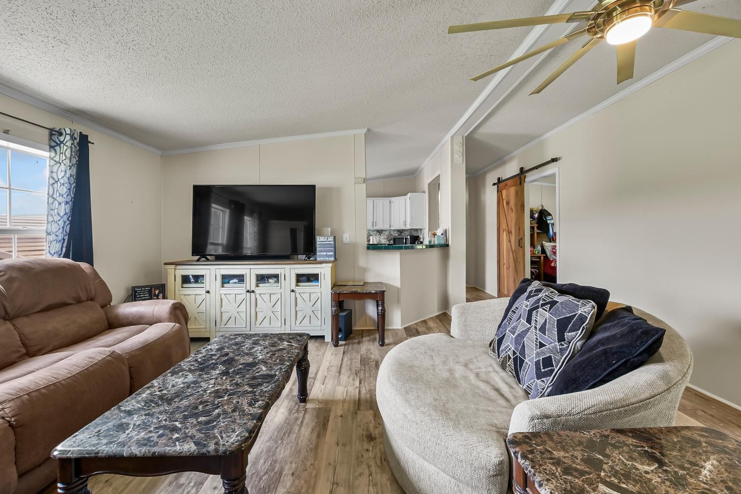 6439 Cedar Grove Road Big Sandy, TN 38221 - Photo 4 of 38 a living room with furniture and a flat screen tv