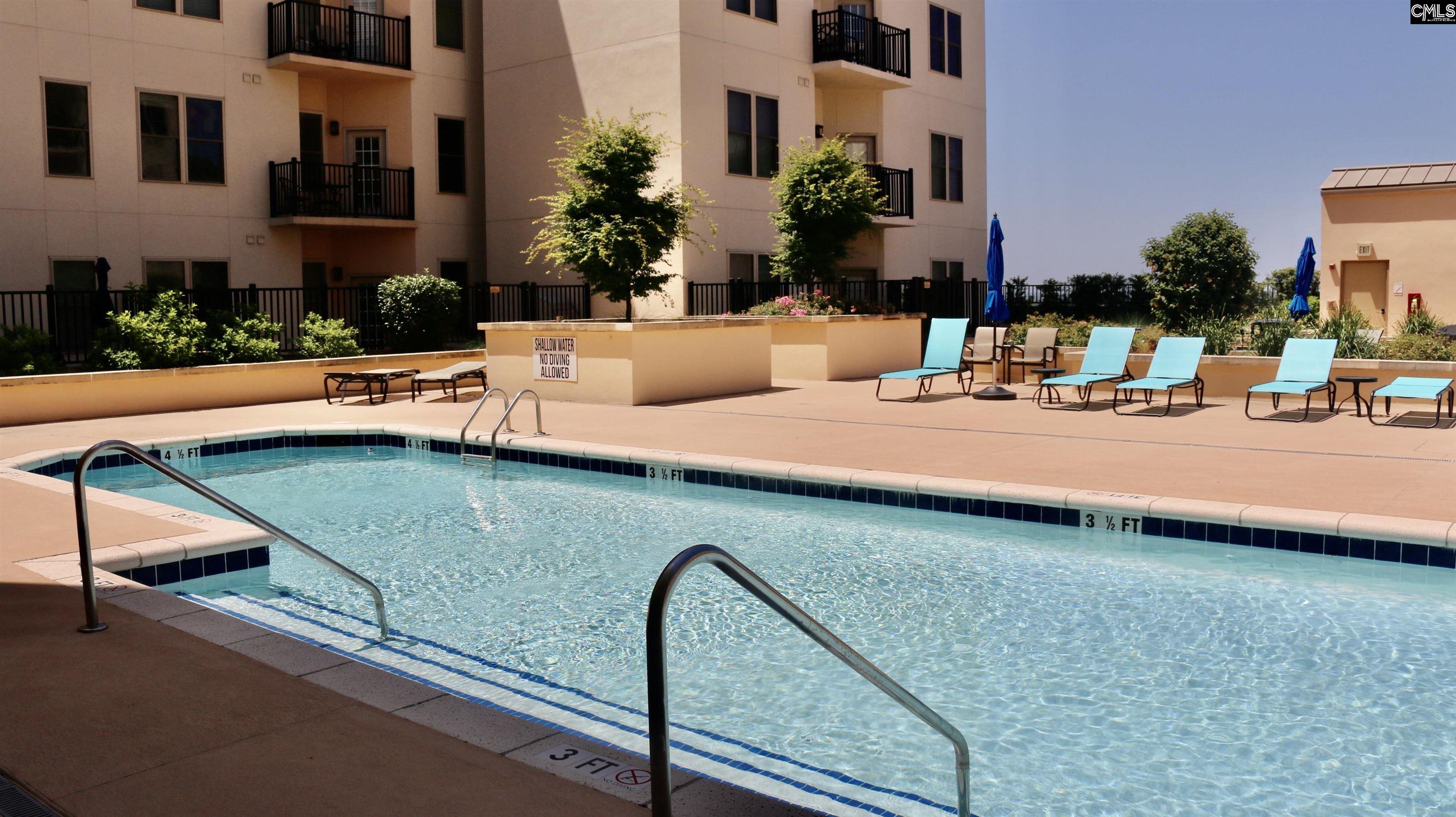 601 Main Street, Unit 323 Columbia, SC 29201 - Photo 56 of 68 a view of a backyard with swimming pool and sitting area