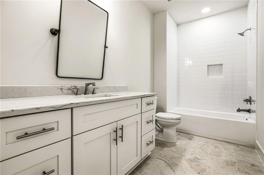 1967 Highgrove Court Decatur, GA 30033 - Photo 51 of 60 a bathroom with a double vanity sink toilet and shower
