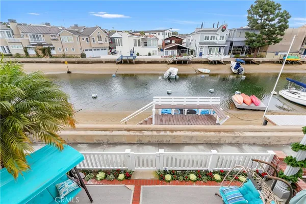 a view of swimming pool with outdoor seating and city view