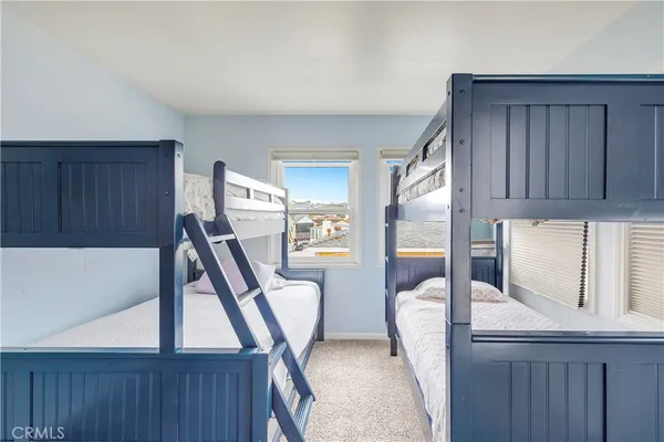 a view of a bedroom with a furniture and staircase