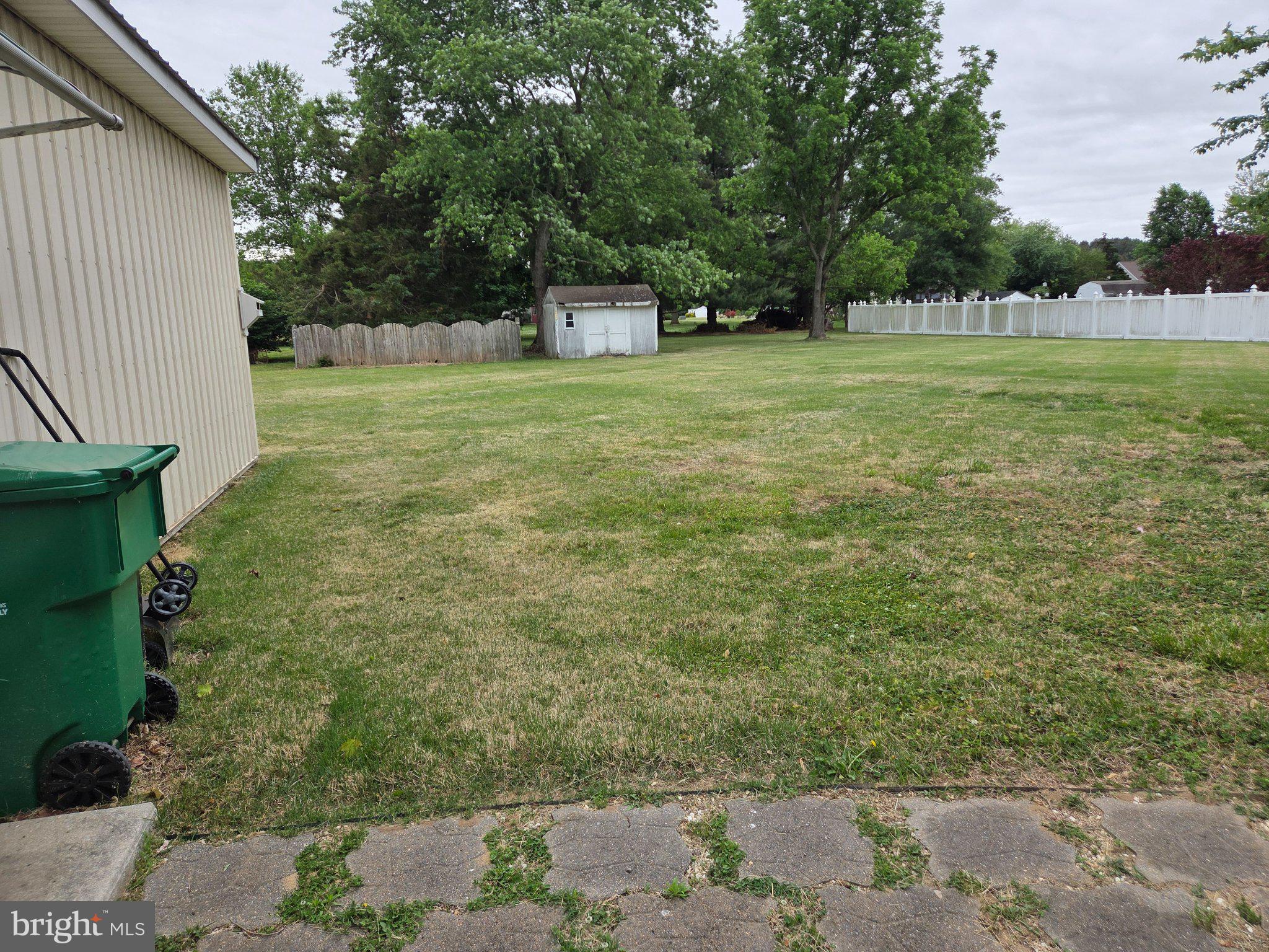 1378 Woodlytown Road Magnolia, DE 19962 - Photo 4 of 15 a view of a big yard with a house