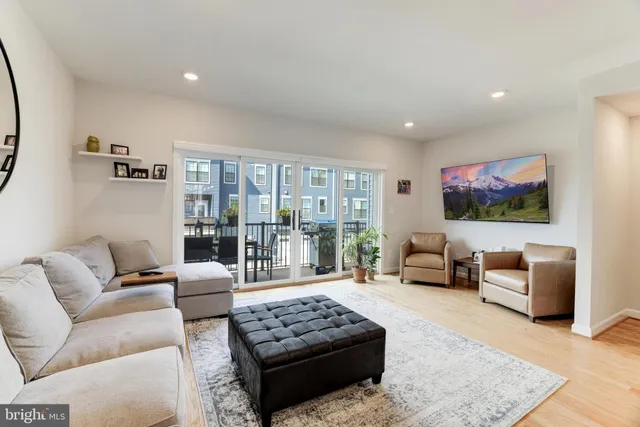a living room with furniture rug and window