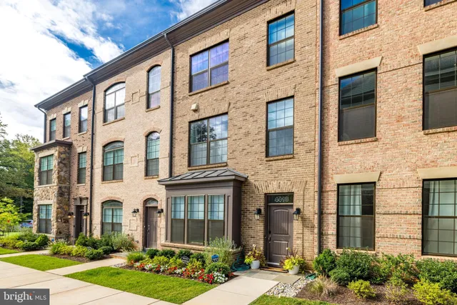 a front view of a house with yard