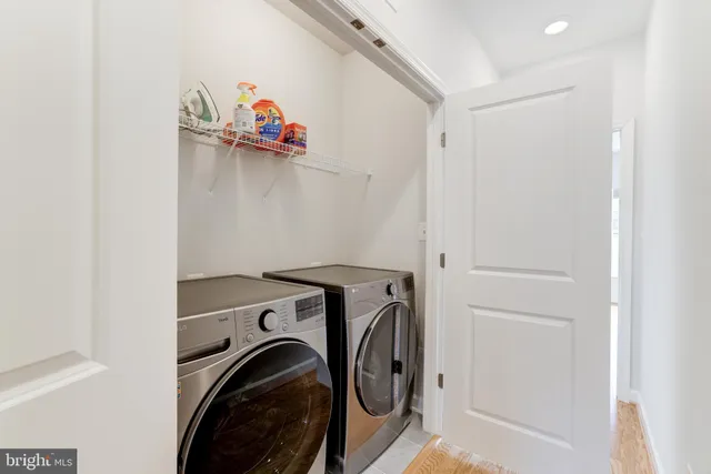 a view of storage and utility room with washer and dryer
