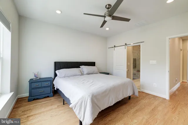 a bedroom with bed and window