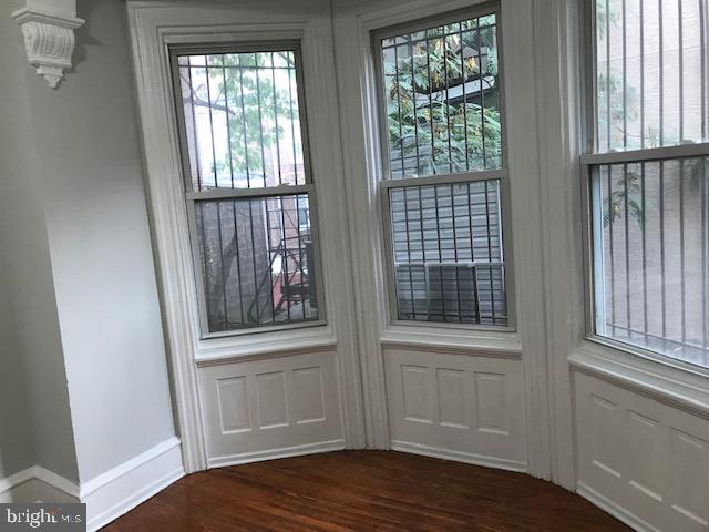 423 South 15th Street Philadelphia, PA 19146 - Photo 3 of 7 a view of an empty room with wooden floor and a window