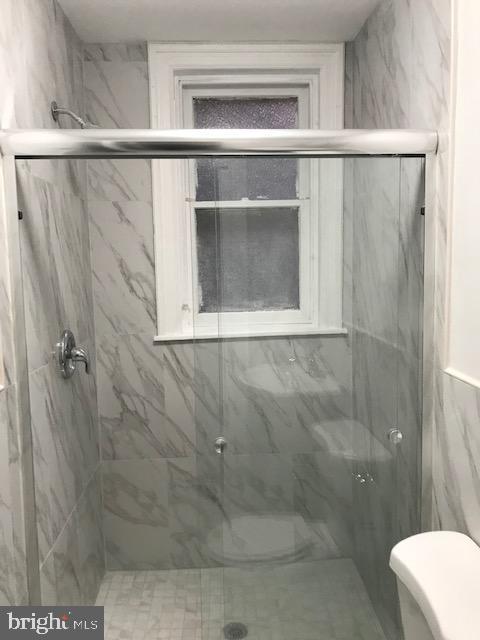 423 South 15th Street Philadelphia, PA 19146 - Photo 4 of 7 a bathroom with a shower and a sink