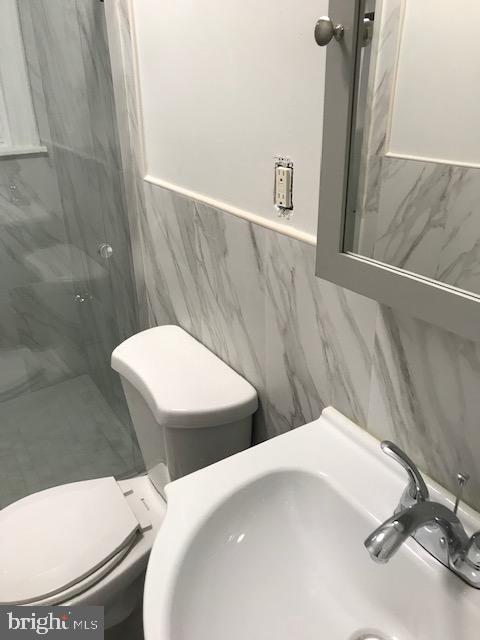 423 South 15th Street Philadelphia, PA 19146 - Photo 5 of 7 a bathroom with a toilet and a sink