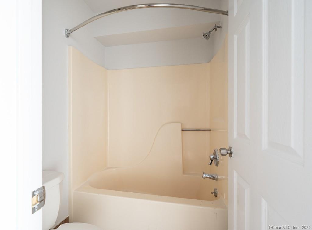 1030 Federal Road, Unit 204 Brookfield, CT 06804 - Photo 19 of 22 a bathroom with a bathtub and a shower