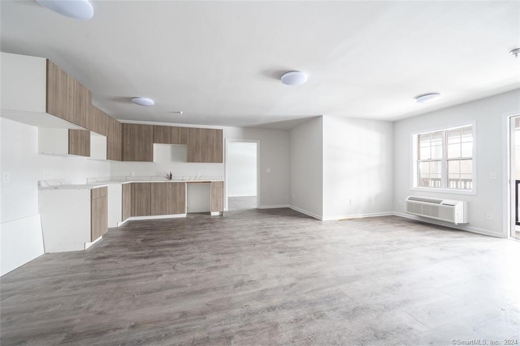 1030 Federal Road, Unit 204 Brookfield, CT 06804 - Photo 4 of 22 a view of a kitchen with a sink and cabinets