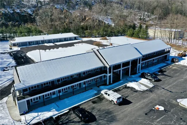 a roof deck with furniture and plants