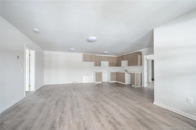 a view of a livingroom with wooden floor