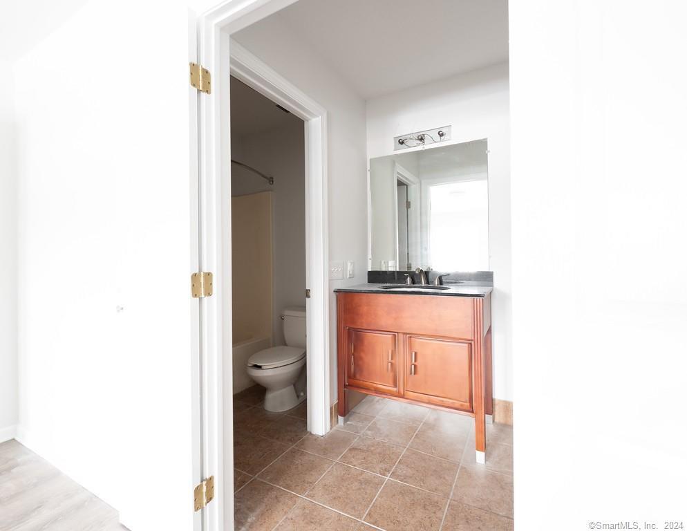 1030 Federal Road, Unit 204 Brookfield, CT 06804 - Photo 10 of 22 a bathroom with a toilet