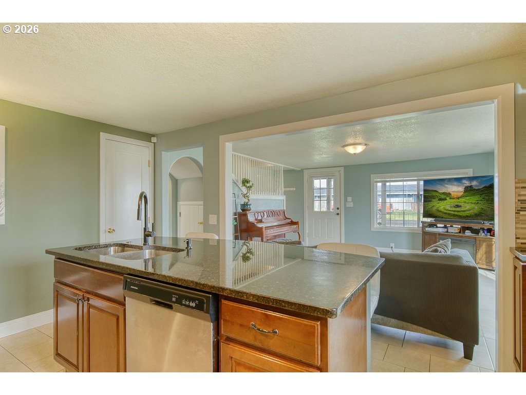 1045 Umatilla Street St. Helens, OR 97051 - Photo 12 of 43 a kitchen with a sink and a refrigerator