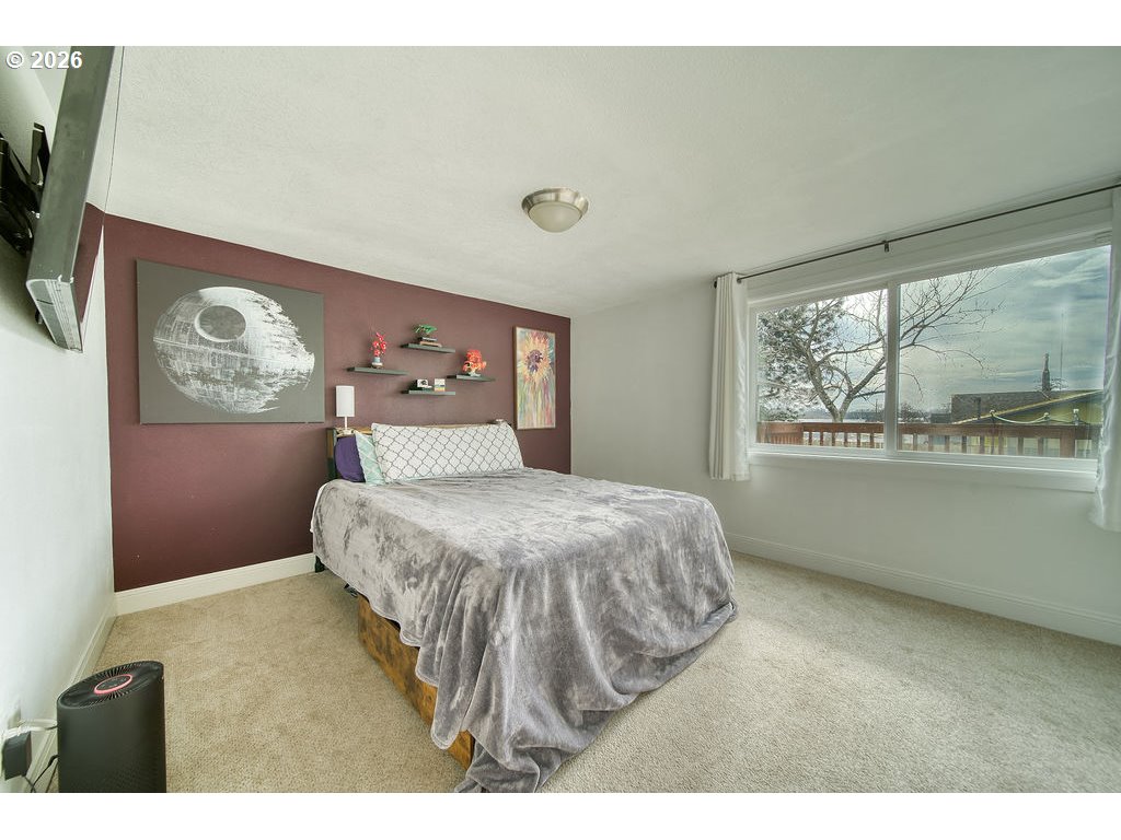 1045 Umatilla Street St. Helens, OR 97051 - Photo 16 of 43 a bedroom with a bed and a large window