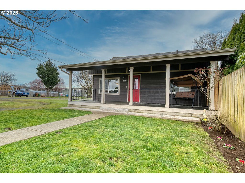 1045 Umatilla Street St. Helens, OR 97051 - Photo 2 of 43 a view of a house with a backyard