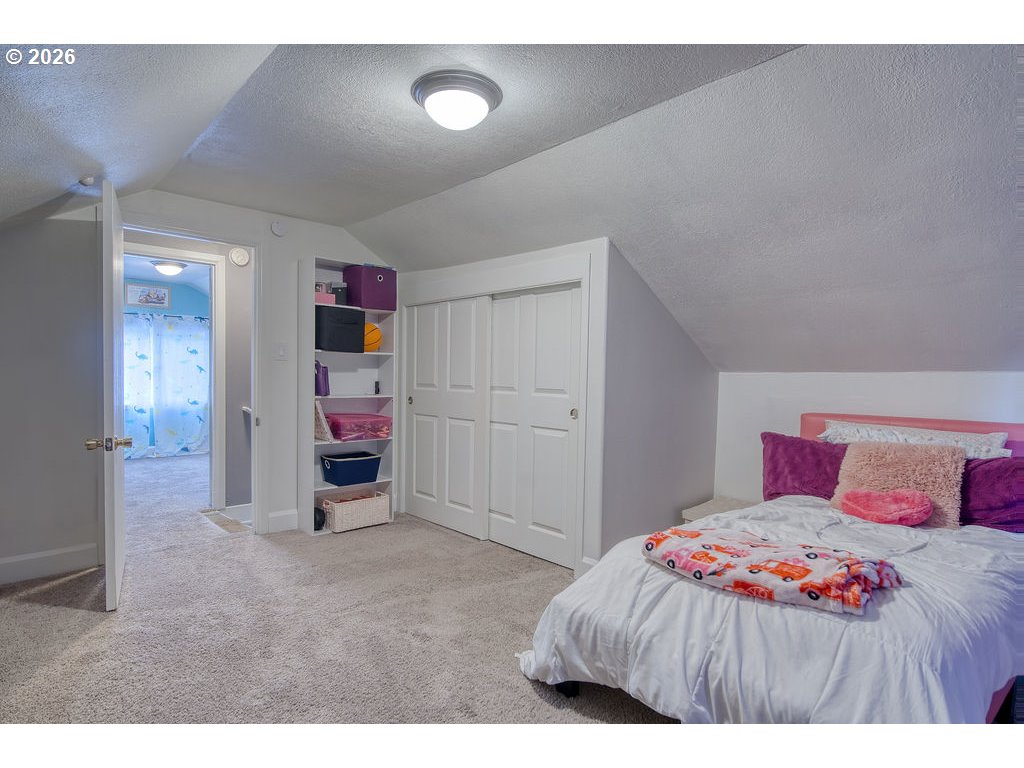1045 Umatilla Street St. Helens, OR 97051 - Photo 27 of 43 a bedroom with a bed and a cabinets