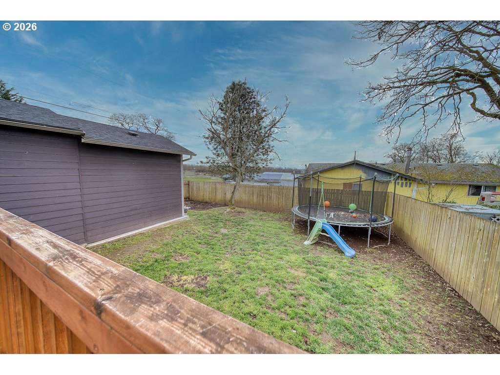 1045 Umatilla Street St. Helens, OR 97051 - Photo 34 of 43 a backyard of a house with table and chairs