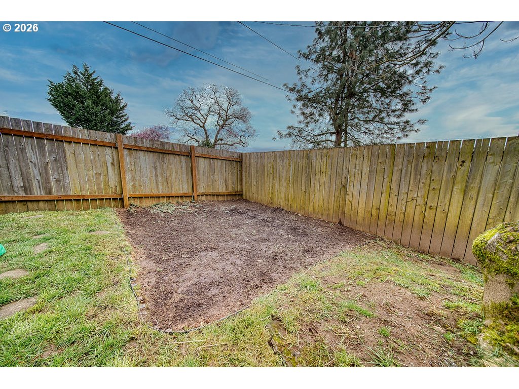 1045 Umatilla Street St. Helens, OR 97051 - Photo 35 of 43 a view of backyard with wooden fence