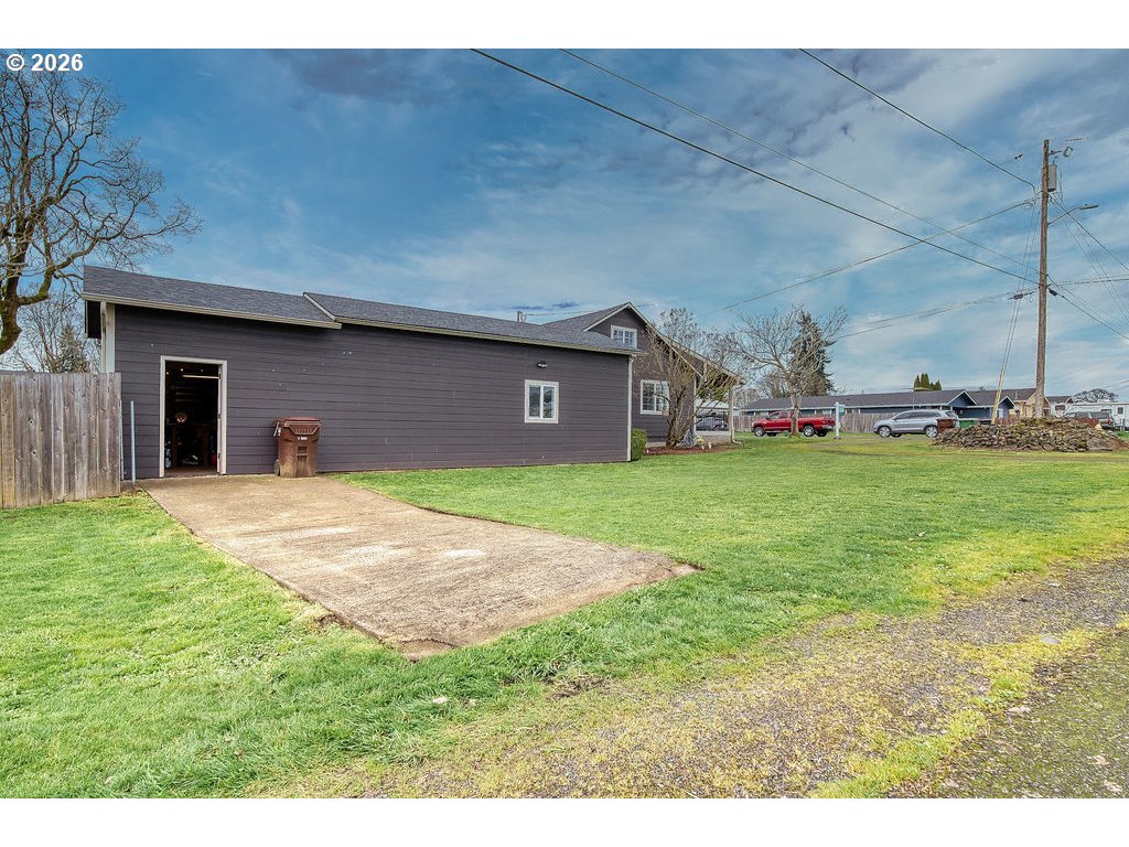 1045 Umatilla Street St. Helens, OR 97051 - Photo 39 of 43 a view of a house with a yard and garage