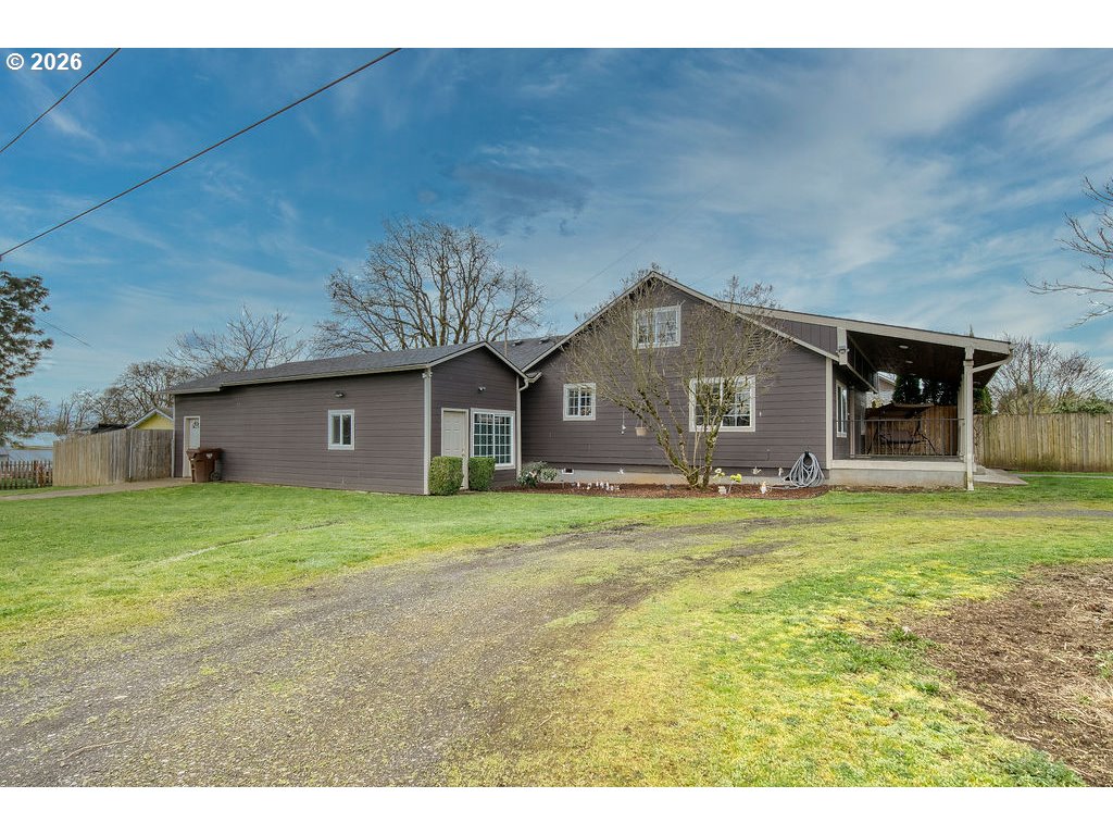 1045 Umatilla Street St. Helens, OR 97051 - Photo 5 of 43 a front view of a house with a garden