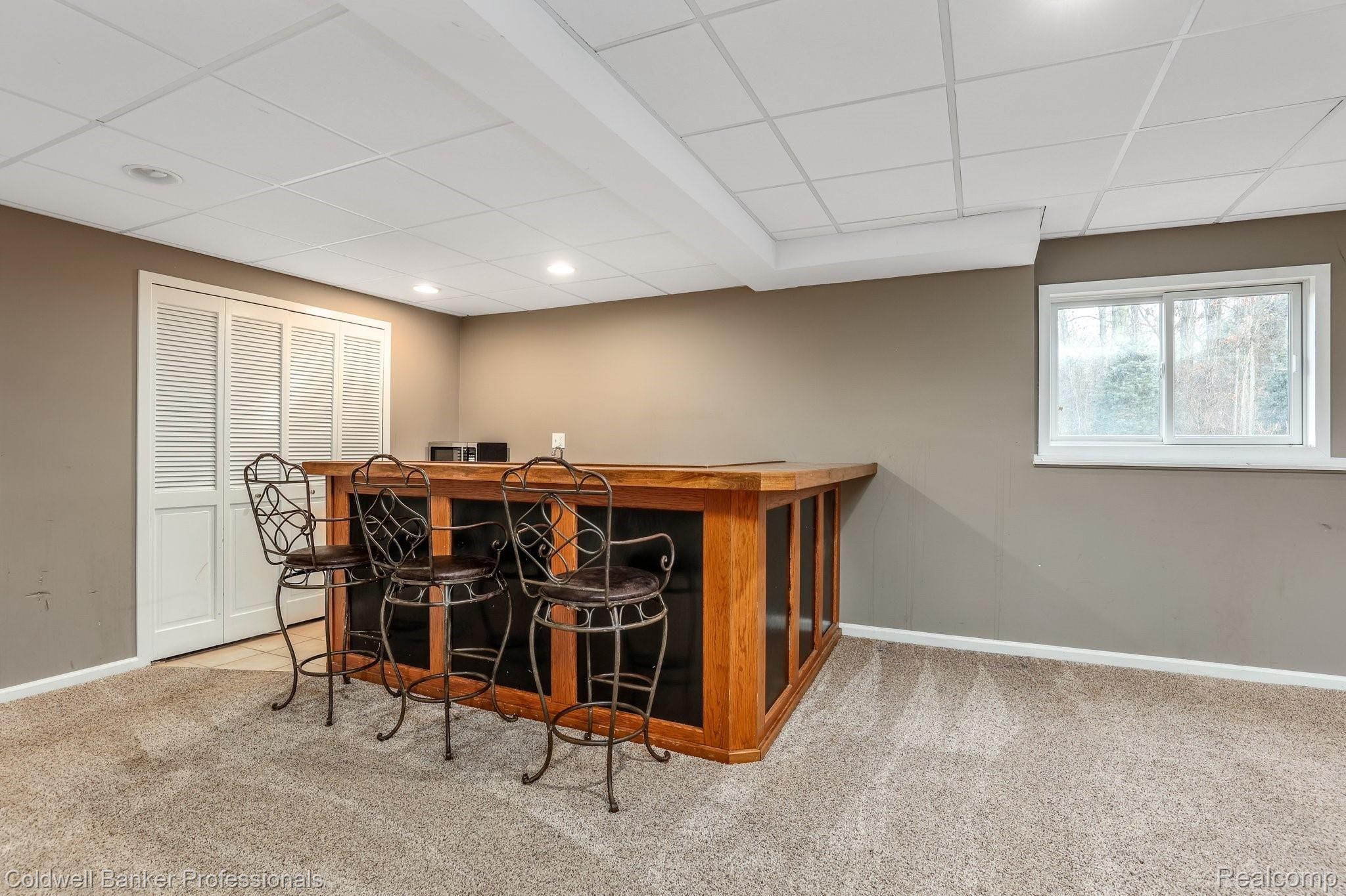 5365 Ridge Trail North Clarkston, MI 48348 - Photo 30 of 55 A basement bar to gather