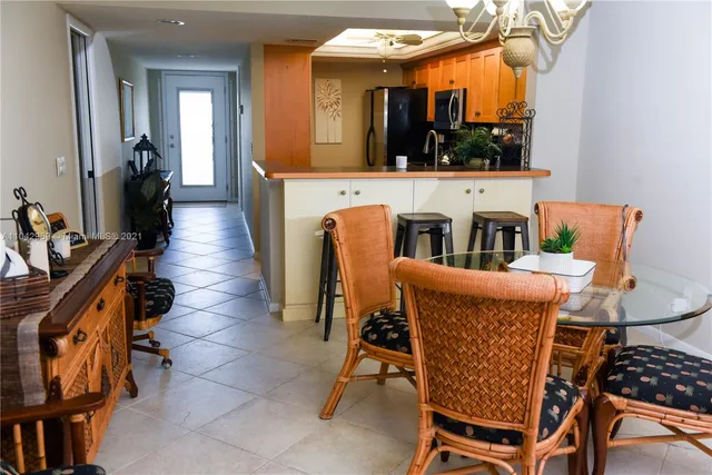 a dining room with furniture and a window