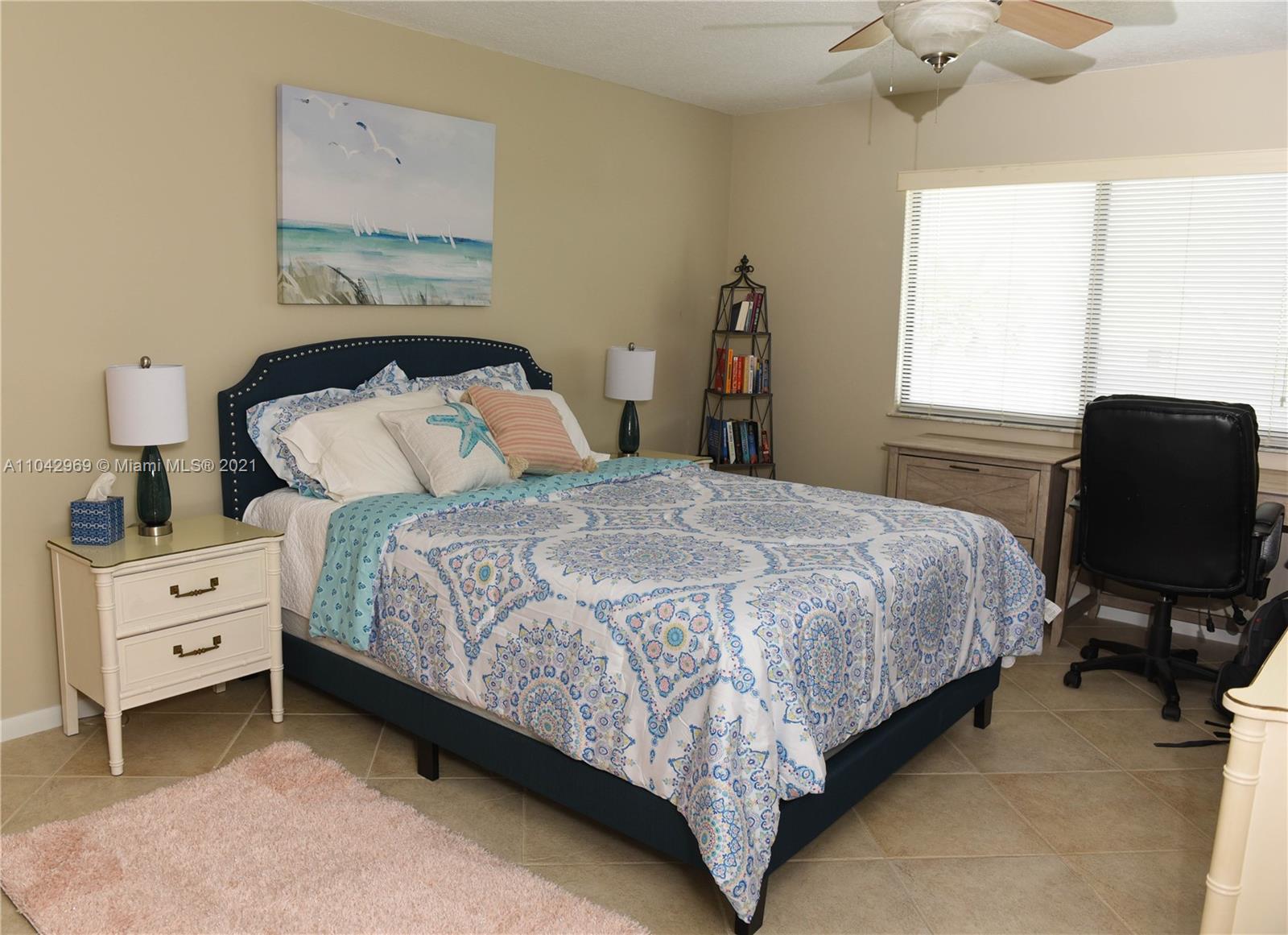 20 Northeast Plantation Road, Unit 306 Stuart, FL 34996 - Photo 10 of 20 a bedroom with a bed and chair