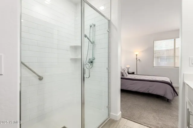 a bathroom with a tub and shower