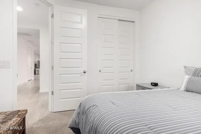 a bedroom with a bed and a cabinets