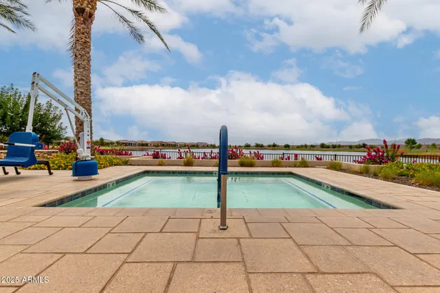 a view of a swimming pool with an outdoor seating