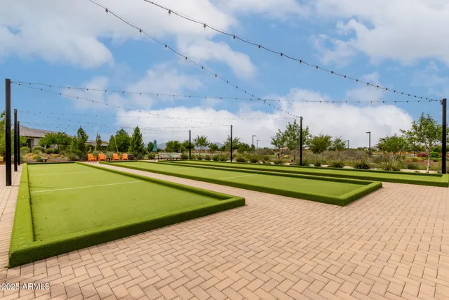 a view of swimming pool is middle in the middle of a yard