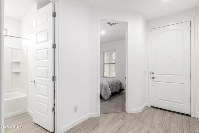 a view of a room that has a bed and a gate