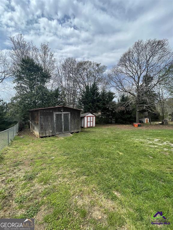 321 Mary Lane Warner Robins, GA 31088 - Photo 2 of 11 a front view of a house with garden